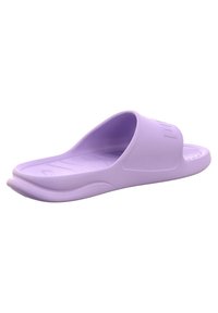 Lilac rubber slide sandal with a wide upper band, textured footbed, and curved sole for comfort. Smooth surface with minimal design details.