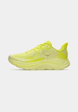 Neon yellow running shoe with a breathable mesh upper, cushioned sole, and distinctive logo on the side. Rounded toe and supportive heel.