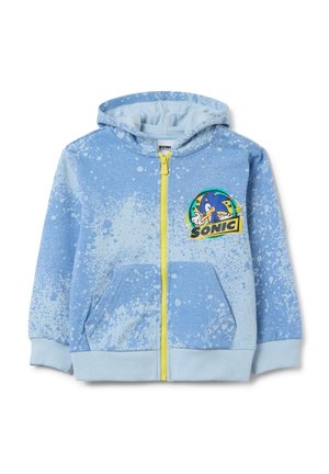 Light blue zip-up hoodie with splatter pattern, featuring a front pocket and a Sonic the Hedgehog graphic on the left chest. Yellow zipper detail.