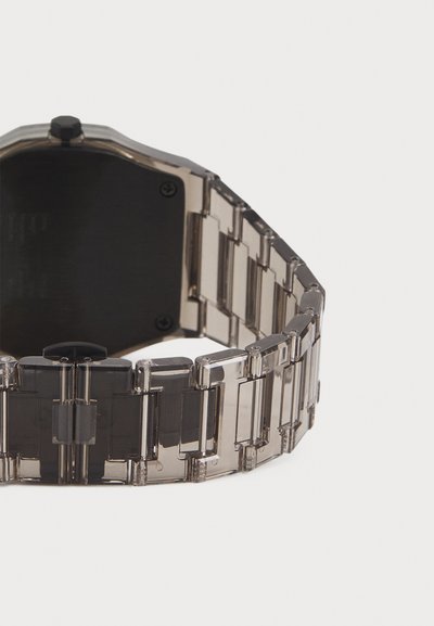 Transparent acrylic watch with a segmented bracelet design, rectangular links, and a black watch face. Features a black crown and clasp.