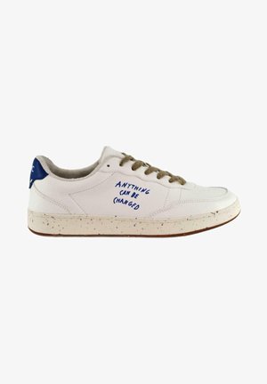 White sneaker with a textured leather upper, brown speckled midsole, blue heel accent, and handwritten text “ANYTHING CAN BE (CHANGED)” on the side.