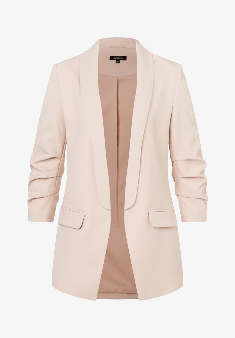 Blazer beige clair pour femme avec manches trois-quarts froncées, devant ouvert et poches à rabat des deux côtés.
