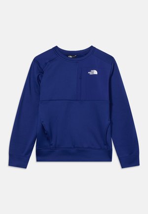 Blå langærmet sweatshirt med rund halsudskæring, lomme med lynlås på brystet og The North Face-logo øverst til venstre.