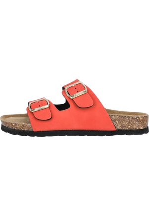 Sandales rouges à glissière avec deux sangles ajustables, boucles en métal, semelle en liège et semelle en caoutchouc texturée noire.