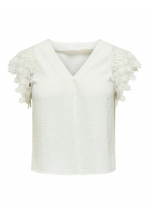 Hvid tekstureret damebluse med V-hals og korte ærmer i blonder med blomsterprint og bølgekant.