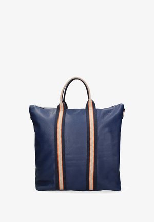 Navy leather tote bag with textured finish, featuring two contrasting striped handles in dark blue, white, and orange. Zipper closure at top.