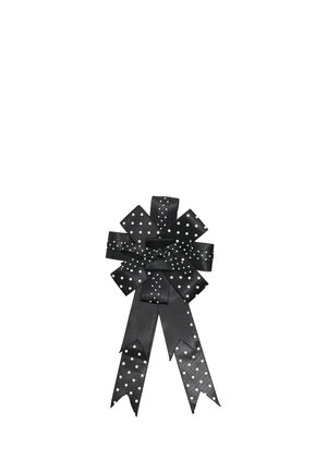 Fiocco in nastro di raso nero con pois bianchi caratterizzato da più anelli e due lunghe code dalle estremità angolate.