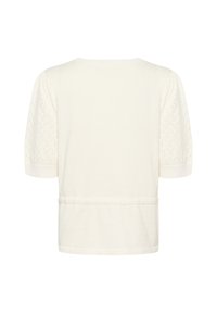 Balts, īss piedurkņu džemperis ar apaļu kaklu. Piedurknes ir ar teksturētu dimanta rakstu. Apakšmala ir taisna ar niansējumu šuvju detaļām.