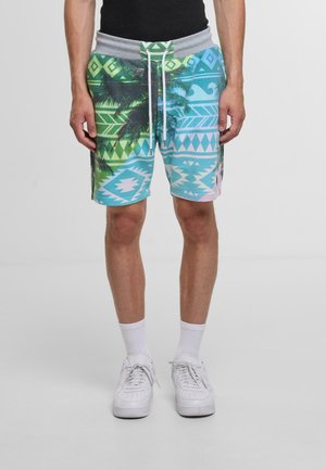 Colorful patterned shorts with a palm tree and geometric design in green, blue, and pink, featuring a gray elastic waistband and drawstring.