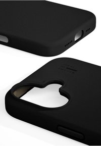 Black silicone phone case with a matte finish, cutouts for buttons and camera, and embossed logo. Smooth texture, rounded edges.