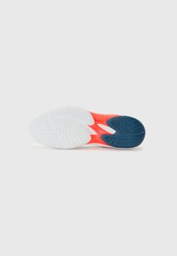 Shoe sole with a white base, vibrant coral midsection, and dark blue heel. Features textured tread and flexible design for grip.