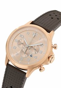 Orologio cronografo in oro rosa con quadrante beige, cinturino in gomma nera testurizzata, ampi indicatori numerici e display della data alle 6.