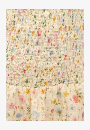 Crème stof met een gerimpeld textuur boven- en ondergedeelte, versierd met geborduurde multicolore kleine bloemen en groene stelen.