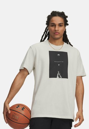 Light gray cotton t-shirt featuring a black graphic print of a basketball player and the text "GREATEST SHOOTER OF ALL TIME."