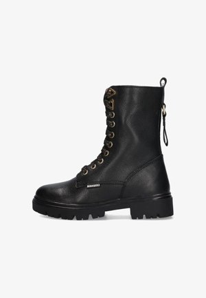 Black leather combat boot with chunky sole, lace-up front with metal eyelets, heel pull tab, and branded tag on side.