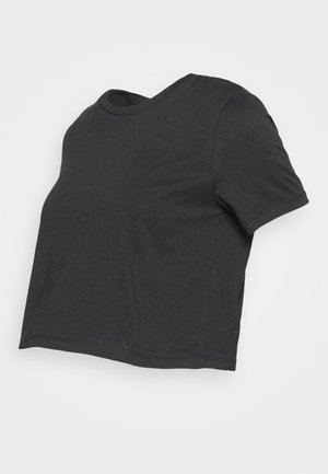 T-shirt cropped preto em algodão macio. Decote redondo e mangas curtas. Design simples e minimalista com uma bainha reta.