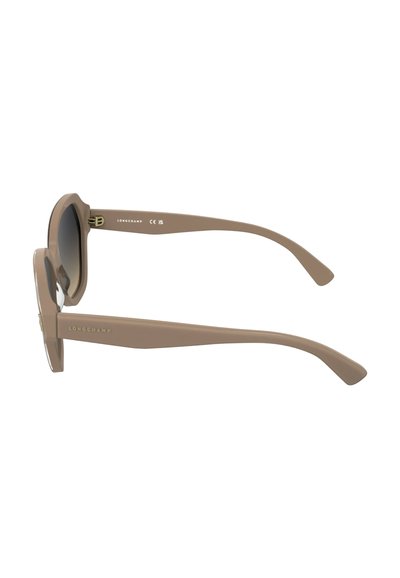 Lunettes de soleil en plastique marron à forme ronde, verres teintés dégradés, et branches fines ornées du logo Longchamp en or.