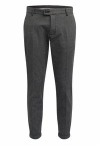 Pantalon gris ajusté avec un motif chevrons, fermeture éclair à glissière et bouton. Ourlets retroussés et doublure intérieure à pois.