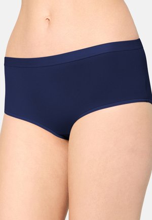 Navy blue seamless hipster-style underwear worn on the lower torso, showing the waist and upper thighs of a person.