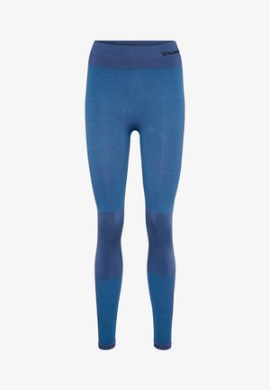 Niebieskie legginsy z teksturowanym wykończeniem, charakteryzujące się jednolitym kolorem i kontrastowym pasem. Materiał wydaje się być elastyczny i dopasowany.