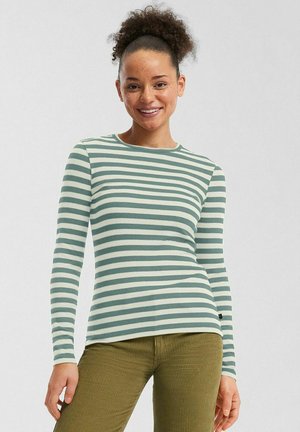 Langdurige gestreepte shirt met lange mouwen in lichtgroen en crème, ribbels, ronde halslijn, gecombineerd met olijfgroene corduroy broek.