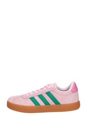 Pink suede sneaker with green stripes, pink heel patch, laces, and gum rubber sole, side view on white background.