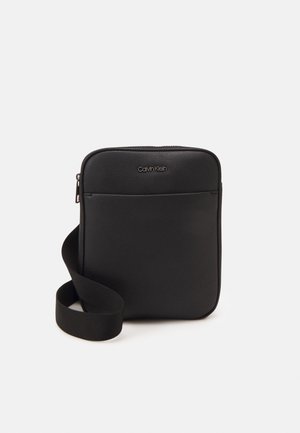 FLATPACK UNISEX - Across body bag - black