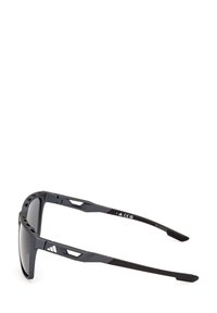 Sport sunglasses featuring a sleek black frame with geometric accents, dark lenses, and textured arms, designed for durability and comfort.