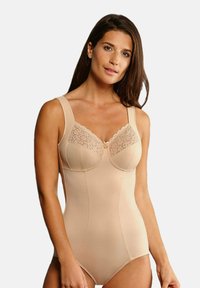 Beige bodysuit with broad straps, lace detailing at the bust, smooth texture, and a fitted design for shaping and support.