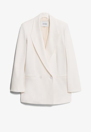 Bílý dvouřadý blazer s ostrými klopami, dvěma předními kapsami a hladkým povrchem. Na štítku je nápis "IVY OAK."