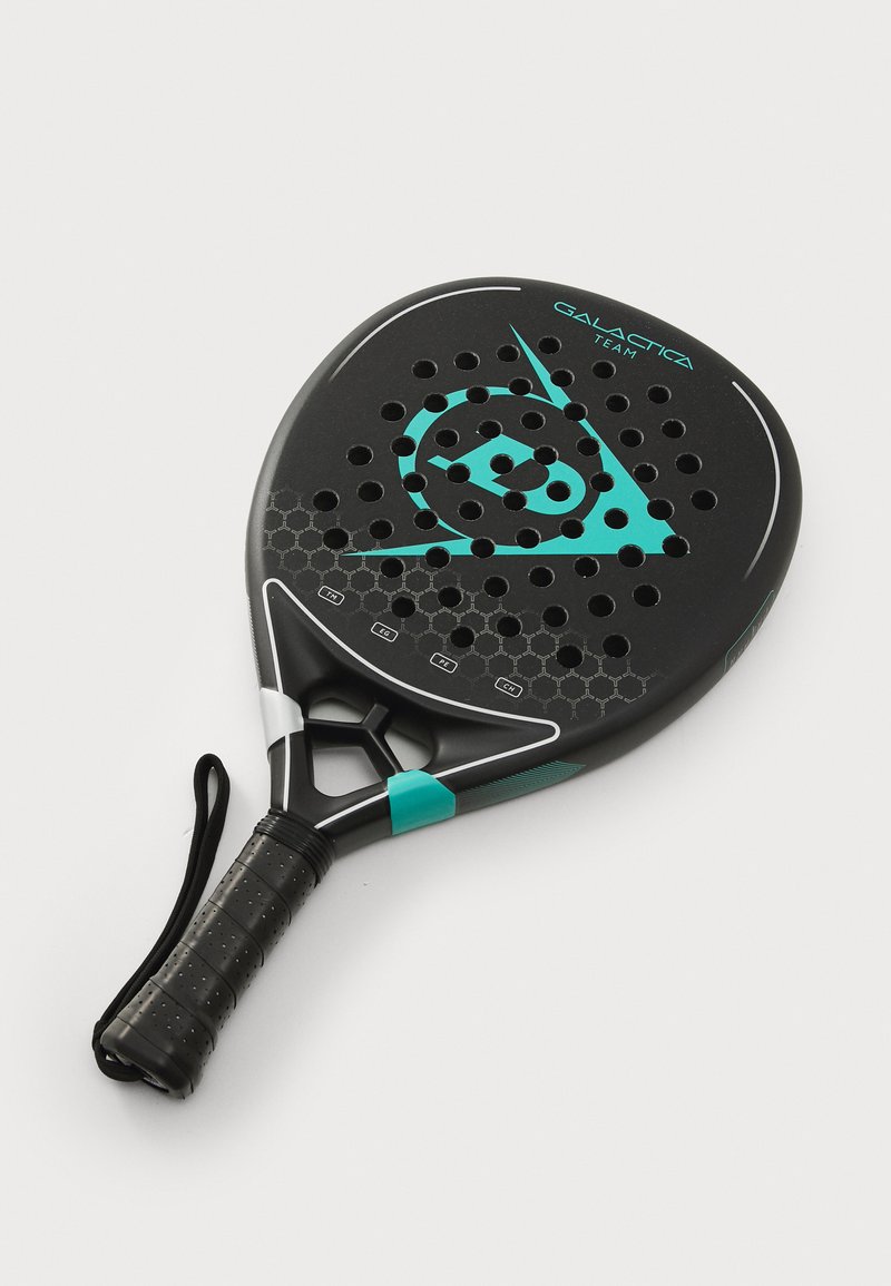 Black padel racket with turquoise accents, featuring a perforated surface, hexagonal pattern, and a textured grip for improved handling.