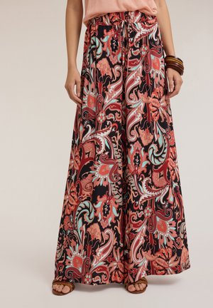 Pantalons larges fluides noirs ornés d'un motif paisley vibrant en rouge, turquoise et rose, avec une taille élastique et un cordon de serrage.