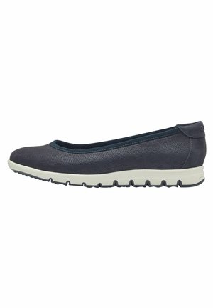 Chaussure slip-on bleu marine avec un dessus lisse et texturé et un bout arrondi, dotée d'une semelle blanche flexible avec des motifs de grip.