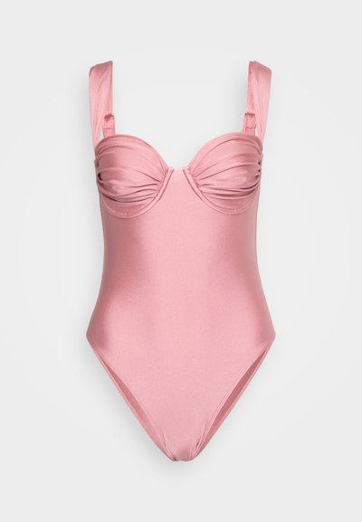 Roosa ühes tükis ujumistrikoo, millel on sile sarnane tekstuur, volditud detailid rinnaosas ja laiad, reguleeritavad rihmad.