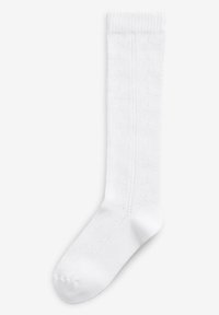 Weiße kniehohe Socke aus weicher Baumwolle, mit einem strukturierten Muster und einem gerippten Bund für besseren Halt. Glatte Verarbeitung und klassischesDesign.