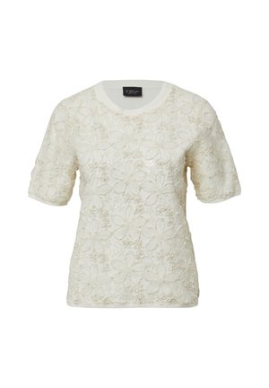 Haut en maille crème à manches courtes avec surcouche en dentelle florale et accents subtils de paillettes, col rond et poignets côtelés.