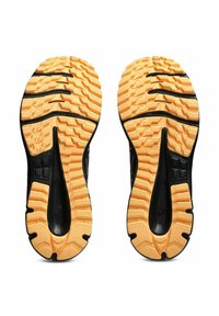 Black athletic shoe soles with a textured pattern and deep grooves, featuring a contrasting orange rubber outsole for grip and stability.