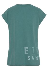 Teal cotton t-shirt with short sleeves and a rounded neckline. Features white printed text "ELB SAND" on the back, left side.