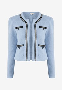 Veste courte bleu clair texturée avec bordure noire et beige, quatre poches décoratives avec boutons noirs et manches longues.
