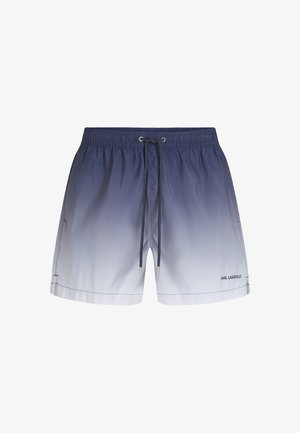 Short de bain homme avec un dégradé bleu vers blanc, taille élastique, cordon noir, poches latérales et petit logo Karl Lagerfeld sur la jambe.