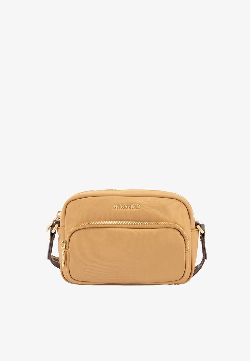 Tan nylon crossover taske med en frontlomme med lynlås, guld hardware og en justerbar rem for ekstra bekvemmelighed. Logo prægede på fronten.