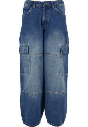 Denim cargo pants in medium blue with a faded appearance. Features multiple side pockets, a loose fit, and wide leg design.