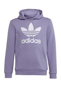 Fialová mikina s kapucí z měkkého materiálu s přední kapsou, na které je velké bílé logo Adidas a tři vodorovné pruhy na logu.