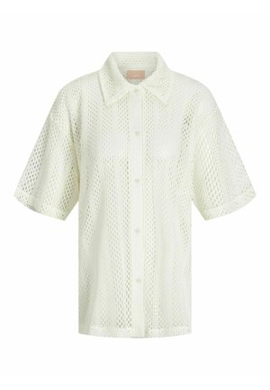 Lyhythihainen, kauluksellinen paita vaaleasta, läpikuultavasta verkkoaineesta, jossa on timanttikuvio ja nappikiinnitys edessä.