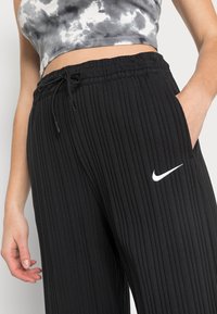 Nike Sportswear Träningsbyxor - black