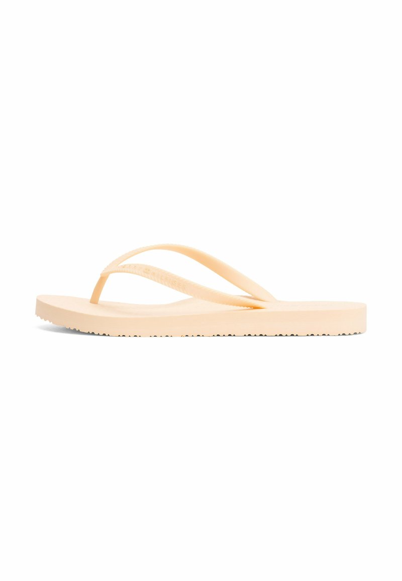Beige gummitøffel med tekstureret sål og simpel tætsiddende rem, vist fra siden på en hvid baggrund.