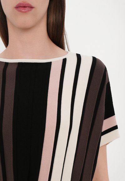 Knit top featuring vertical stripes in black, pink, and cream. It has a round neckline and short sleeves, with a smooth texture.