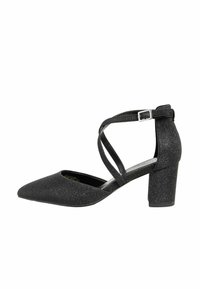 Scarpa nera elegante con punta affusolata, texture glitterata, tacco spesso e chiusura alla caviglia con cinturino incrociato.