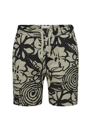 Shorts negros con patrón floral y superficie texturizada, con cinturilla elástica y cordón ajustable. El color principal es verde claro con diseños en negro.