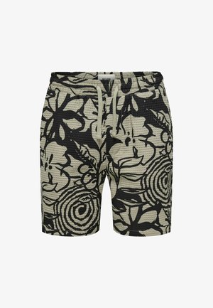 Black floral patterned shorts with a textured surface, elastic waistband, and drawstring. Main color is light green with black designs.